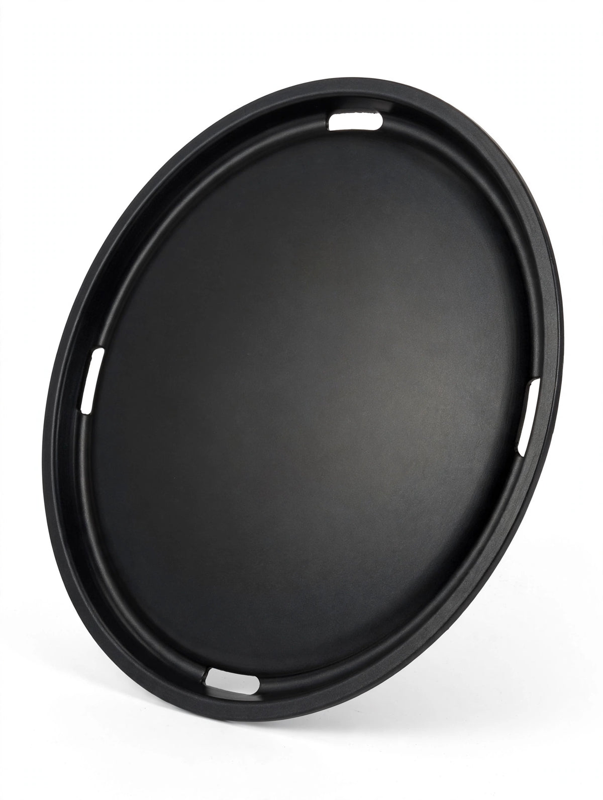 Flat round commercial Korean BBQ grill plate, angled studio view showing thin profile and vent slots